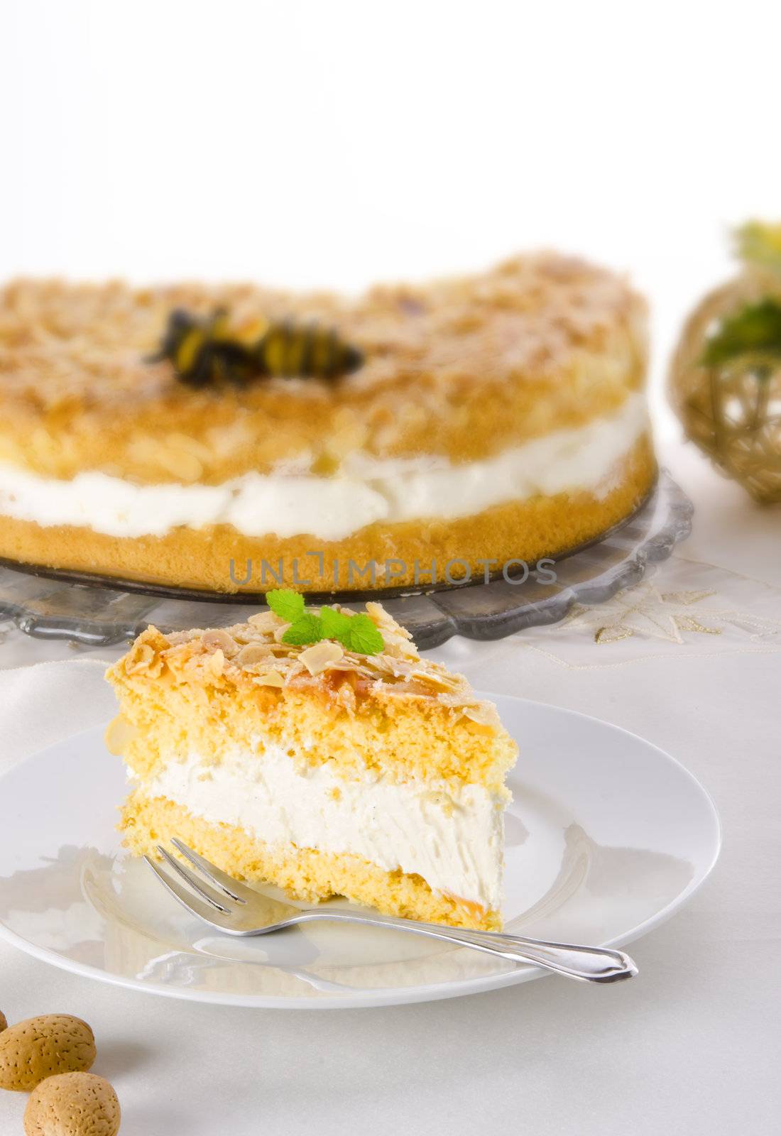 flat cake with an almond and sugar coating and a custard or cream filling