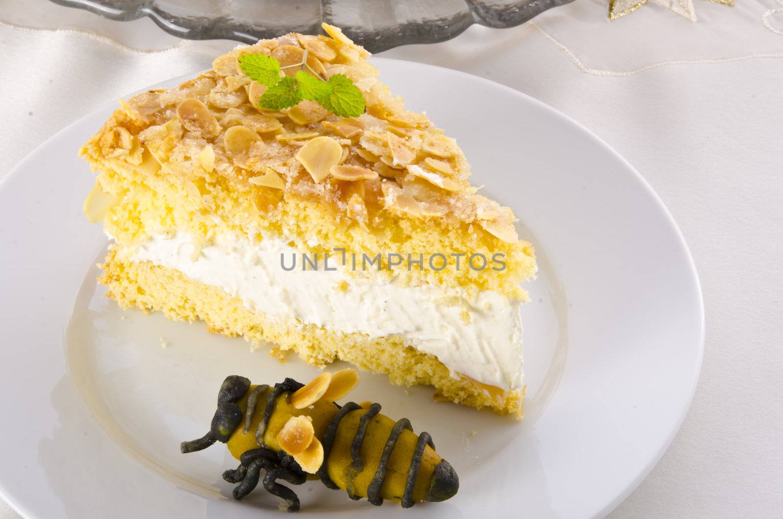 flat cake with an almond and sugar coating and a custard or cream filling