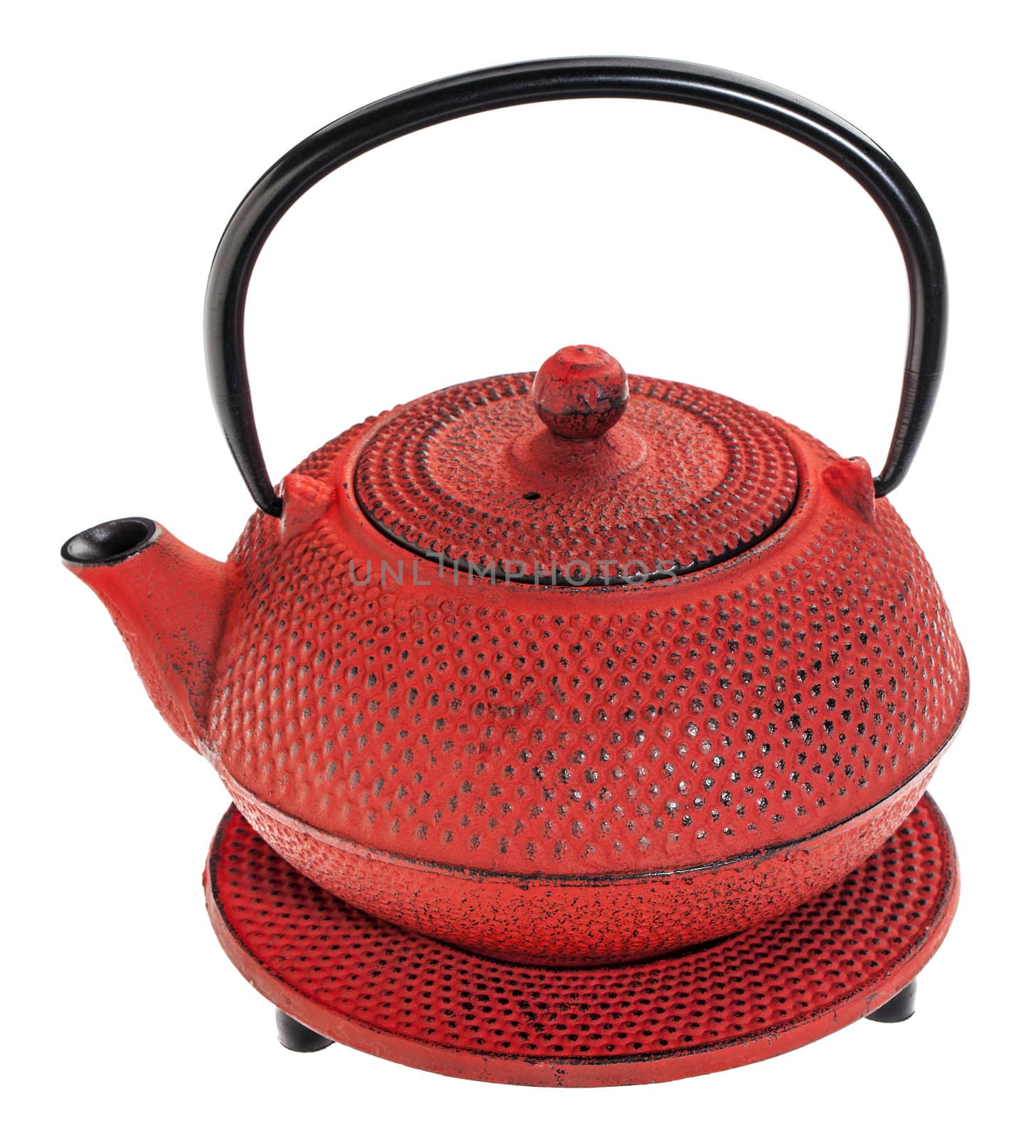 red hobnail tetsubin - cast iron traditional Japanese tea pot on a trivet, isolated on white