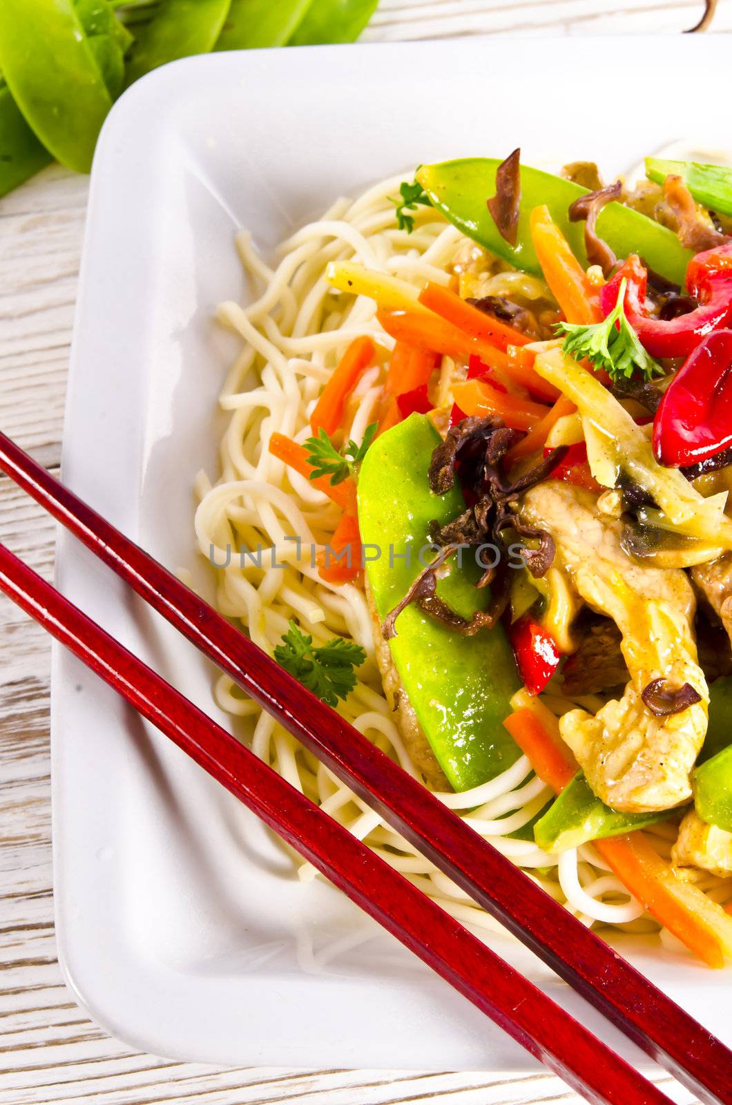 Noodles with pork and vegetables in plum sauce by Darius.Dzinnik