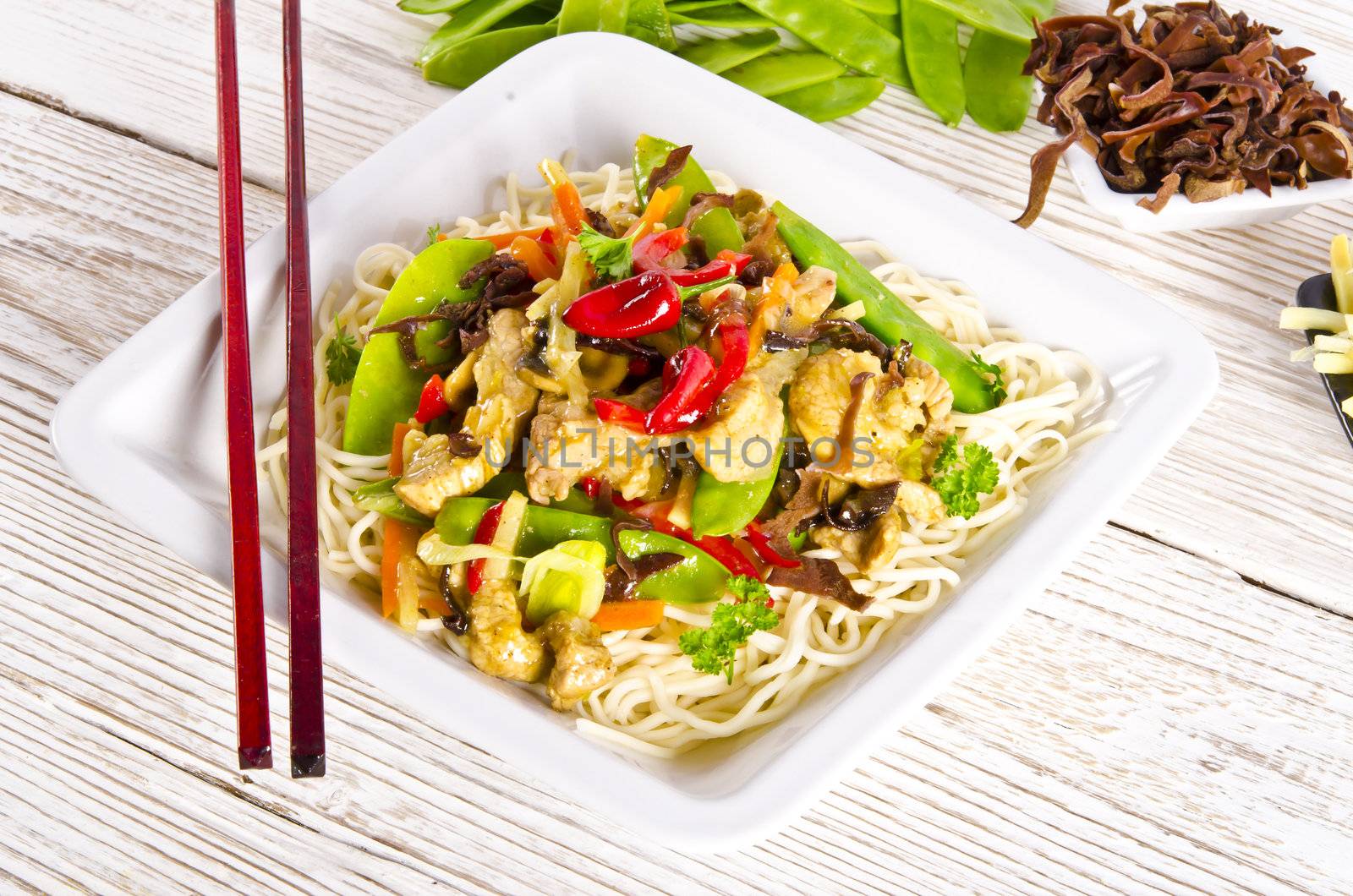 Noodles with pork and vegetables in plum sauce by Darius.Dzinnik