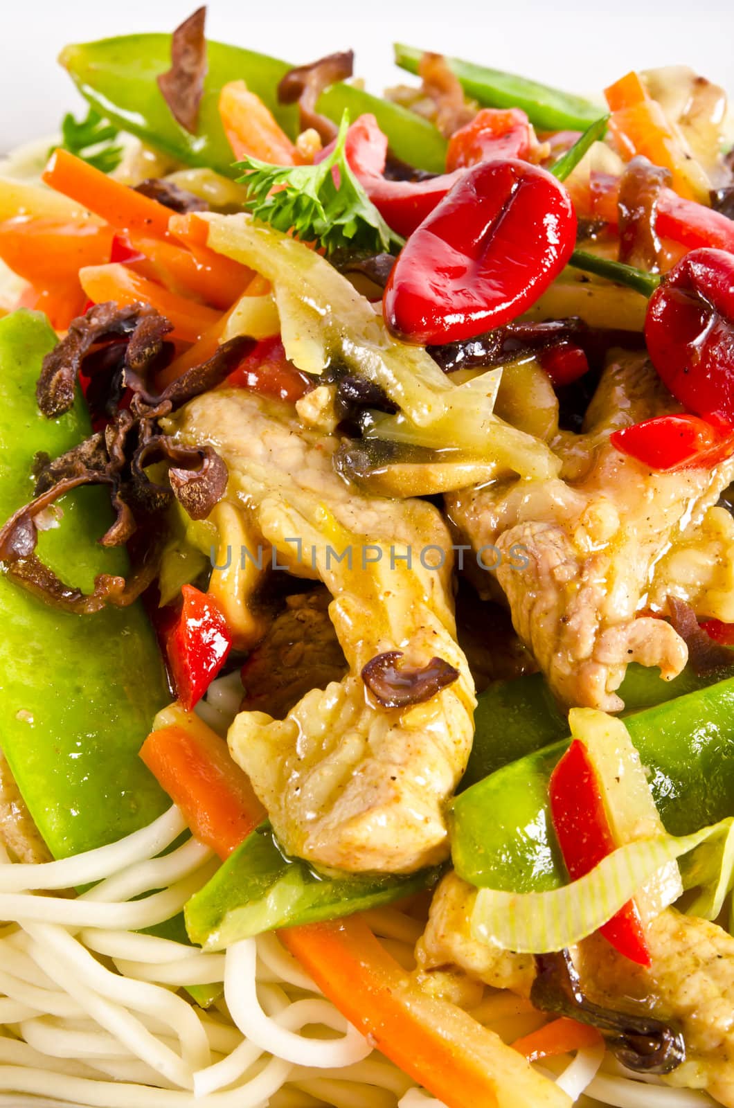 Noodles with pork and vegetables in plum sauce