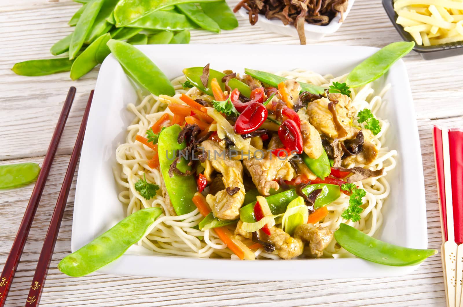 Noodles with pork and vegetables in plum sauce by Darius.Dzinnik