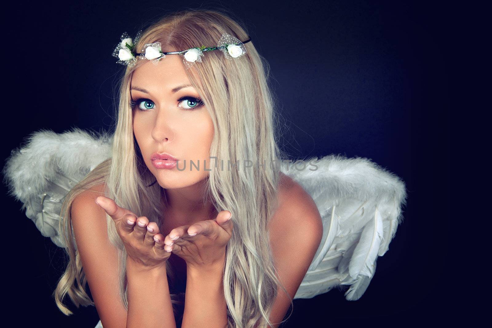 Portrait of a blonde in white Angel costume 