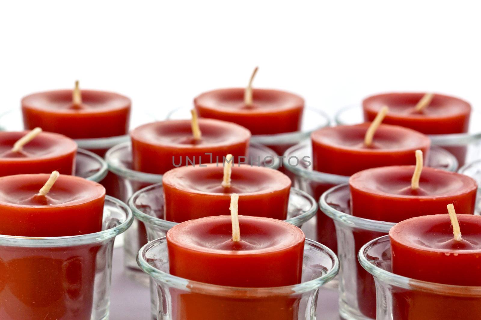 red candles on the glass candle holder