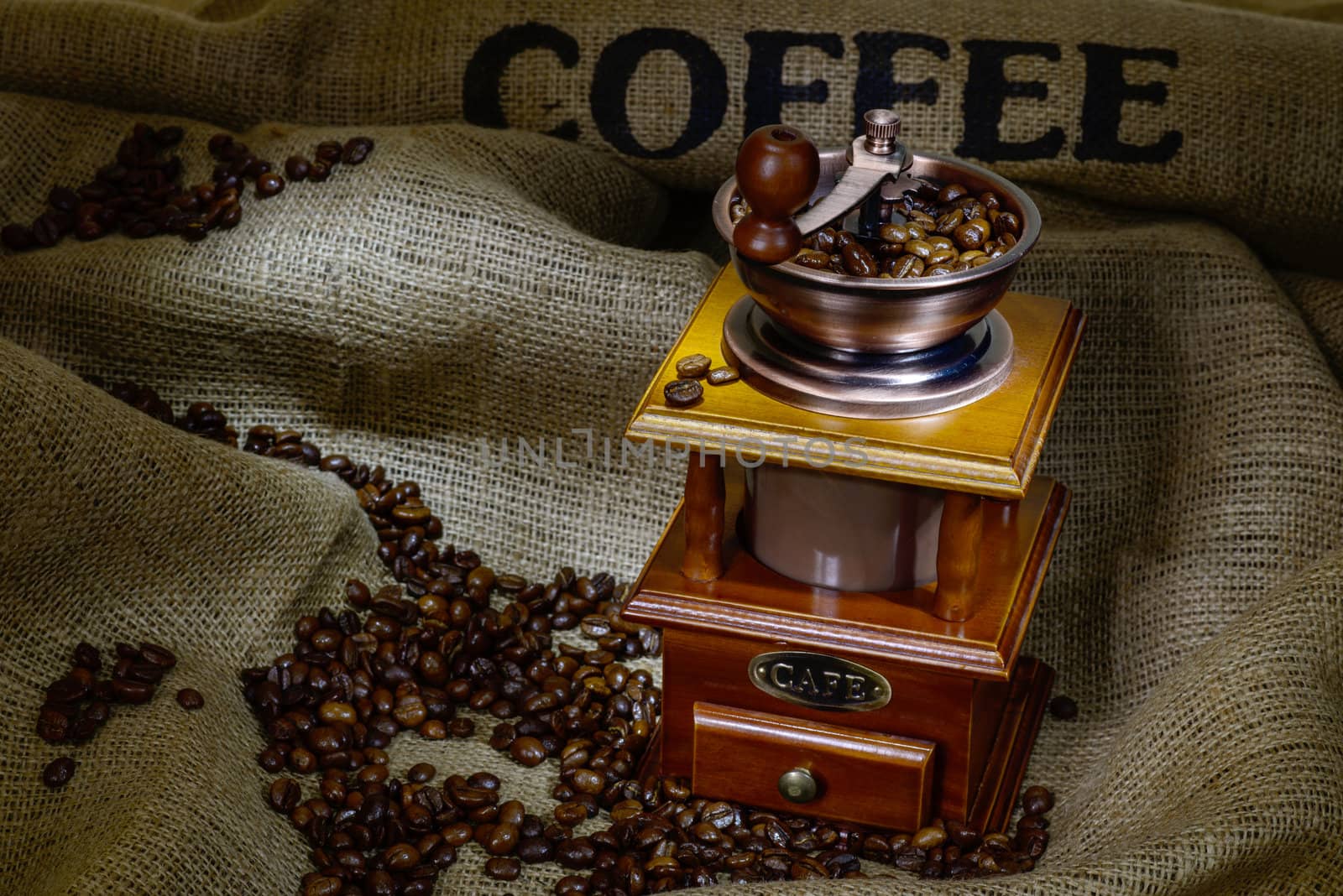 Coffee Mill with beans and burlap. still life