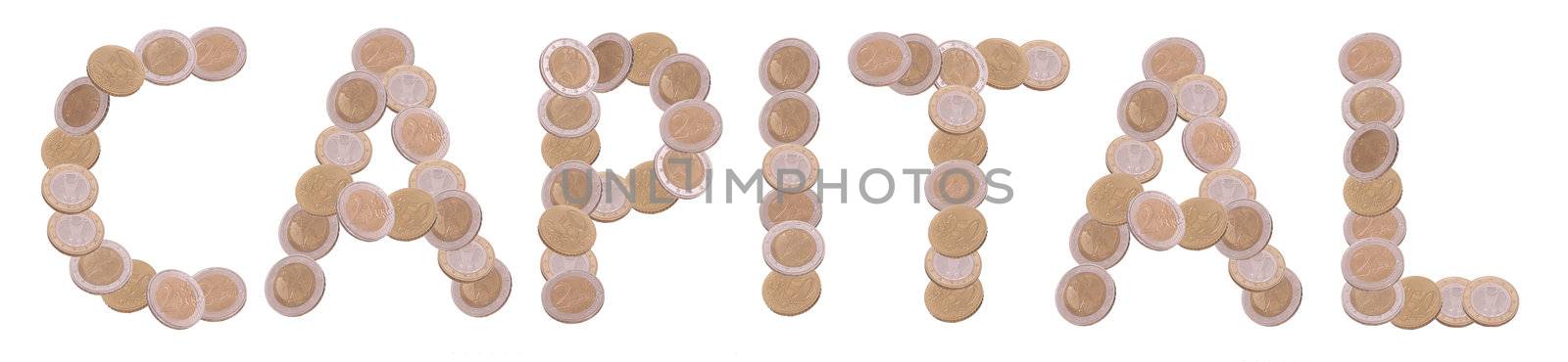 capital - written with coins on white background