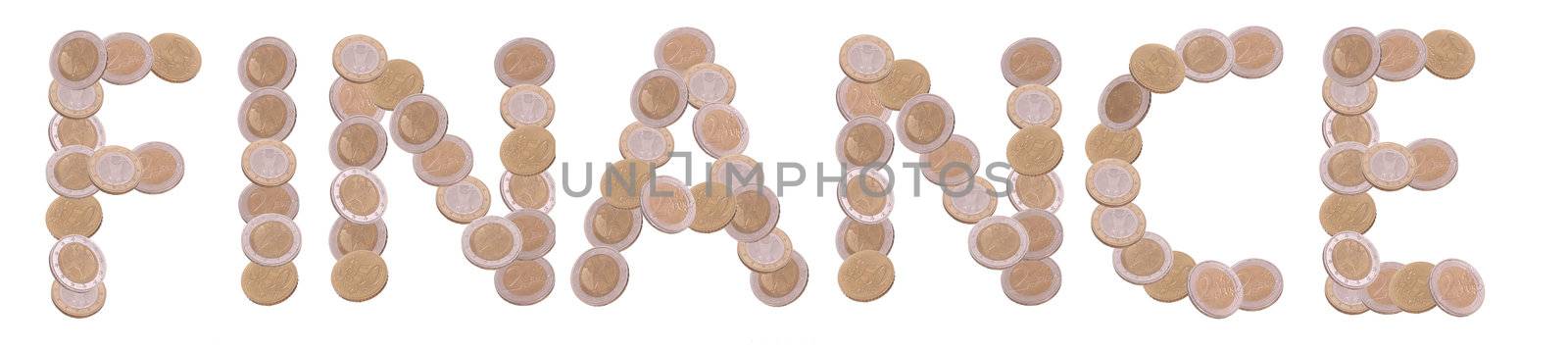 finance - written with coins on white background