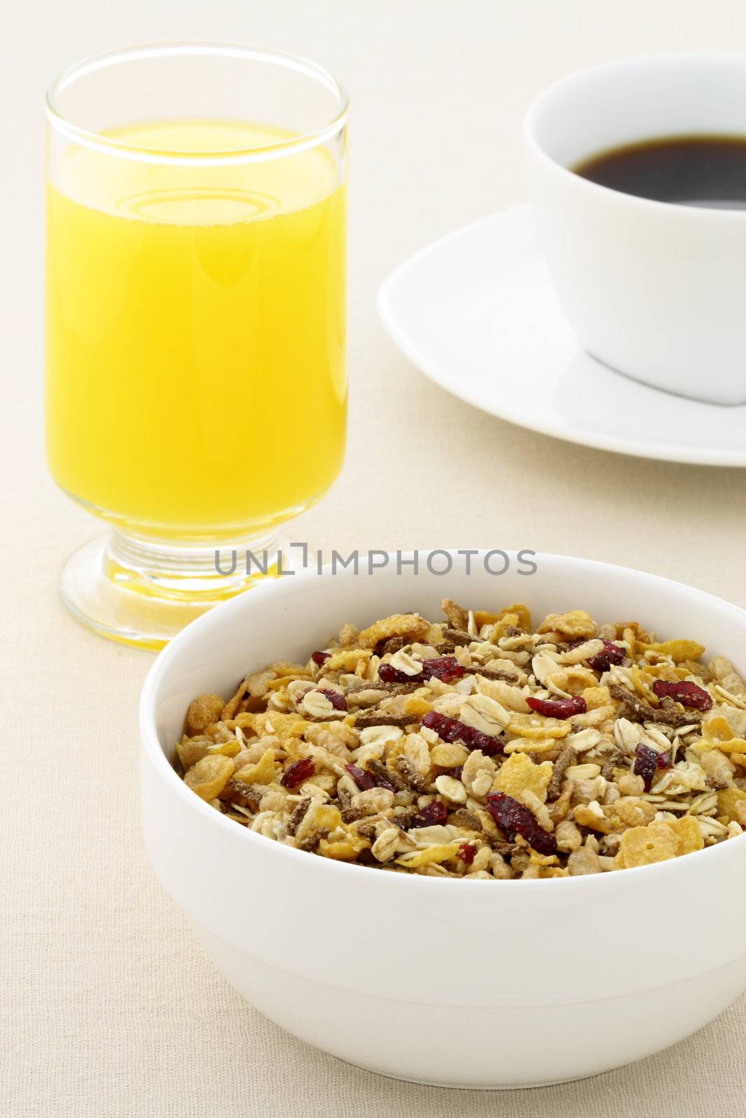 delicious breakfast with fresh orange juice, hot coffee and a healthy bowl of cereal.