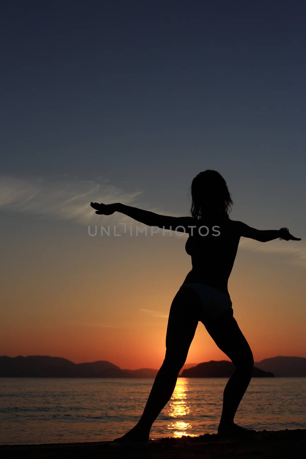 silhouette of a girl at the beach by smoxx