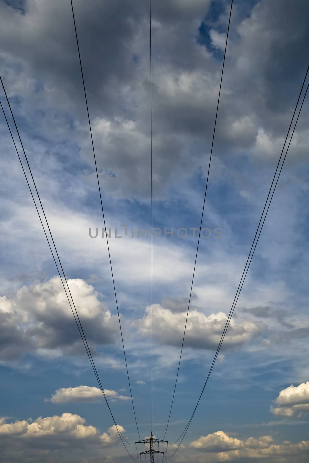 the power lines and towers against blue sky by Nickondr