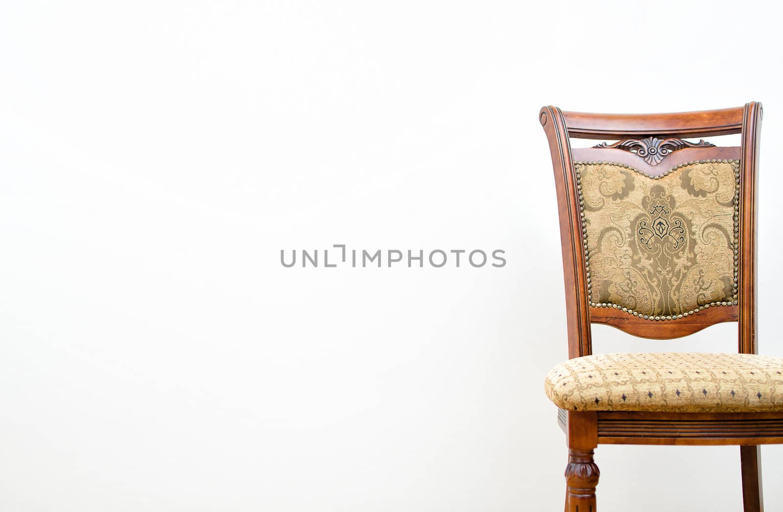 Classic chair on white wall background by dmitrimaruta