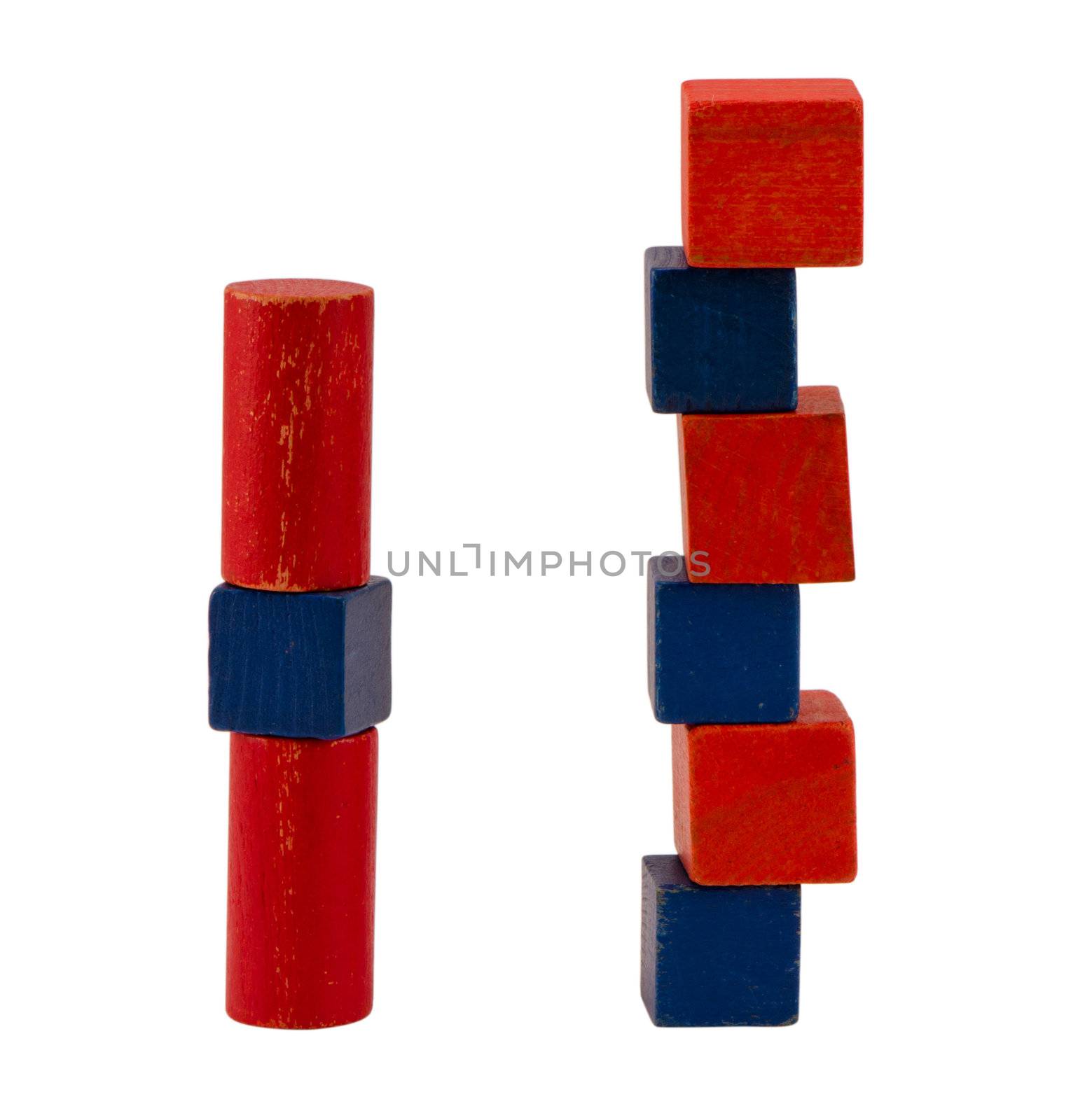 composition of red blue wooden retro log toy brick constructions stand isolated on white background.