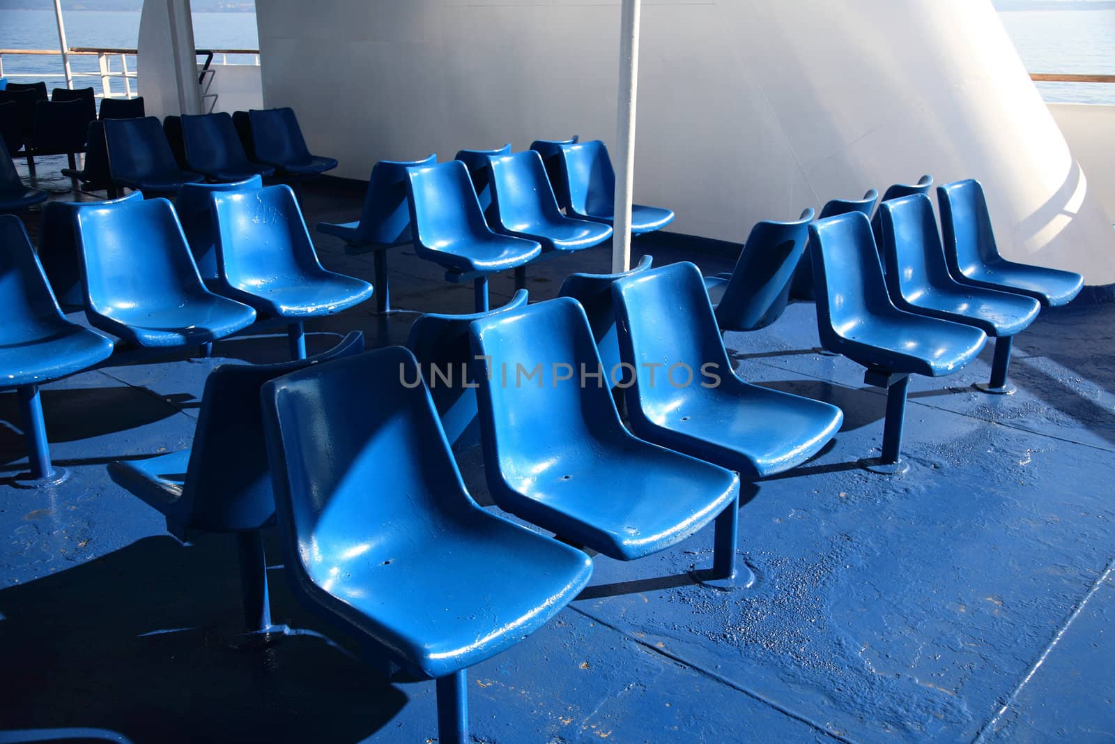 plastic blue chairs of a cruise ship
