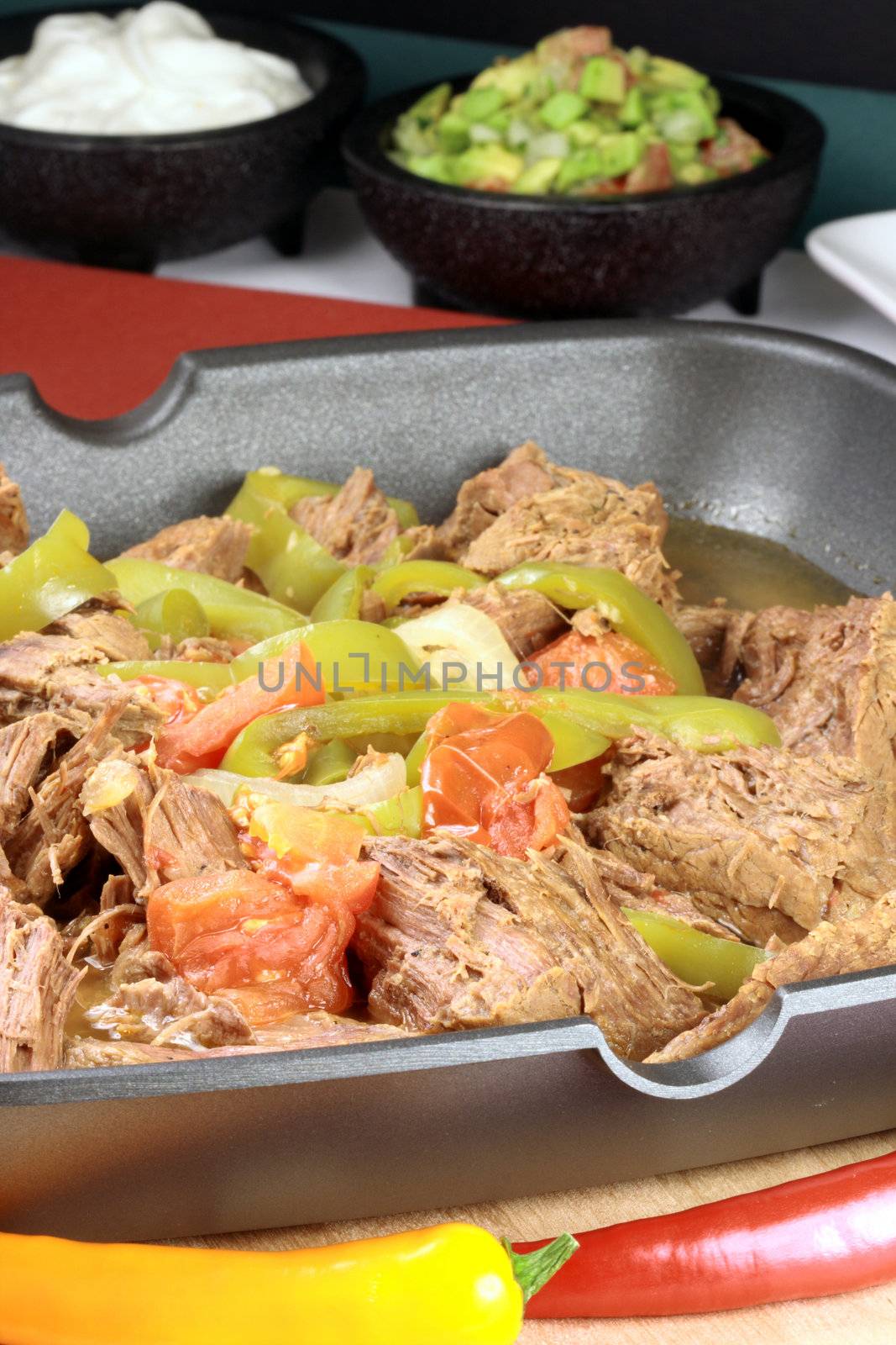 perfectly made mexican machaca beef  delicious aromatic slow down cooked  with hot  and sweet peppers  