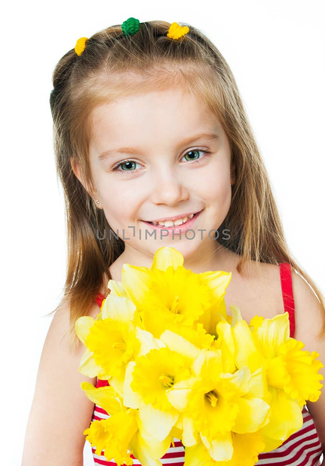 Happy smiling little girl with flowers on a white background