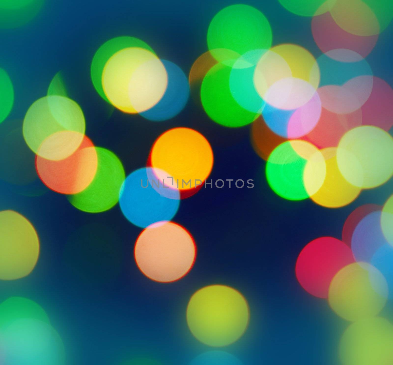 Color Bokeh against a dark background for use at graphic design