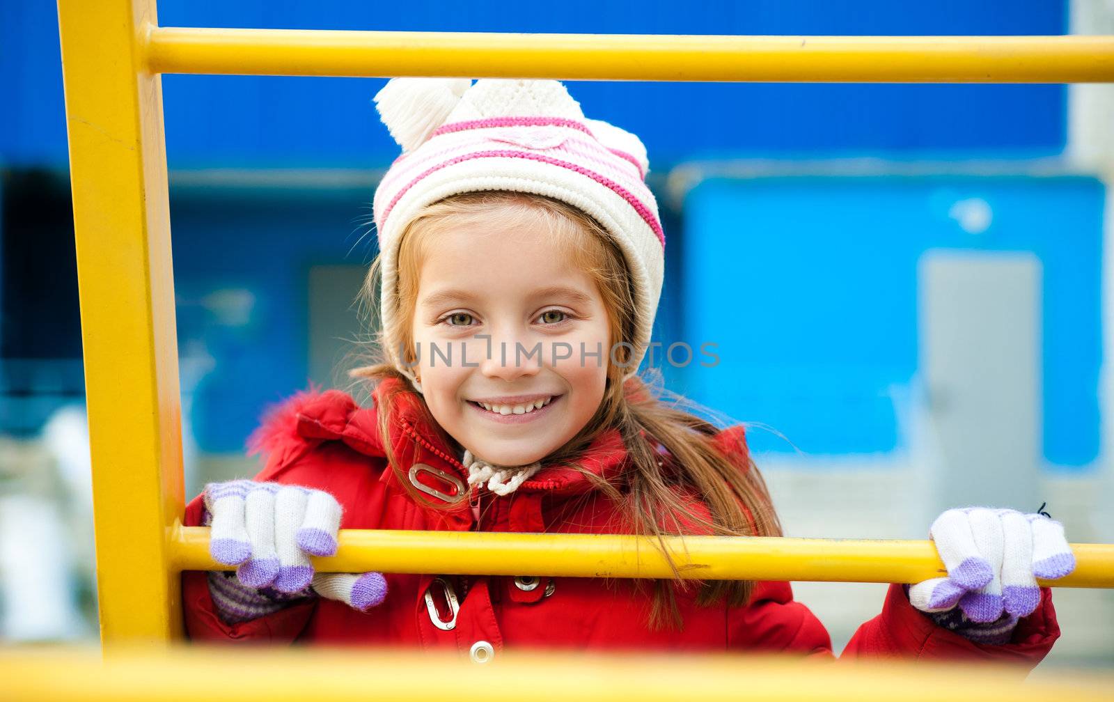 Cute smiling girl on outdoor playground