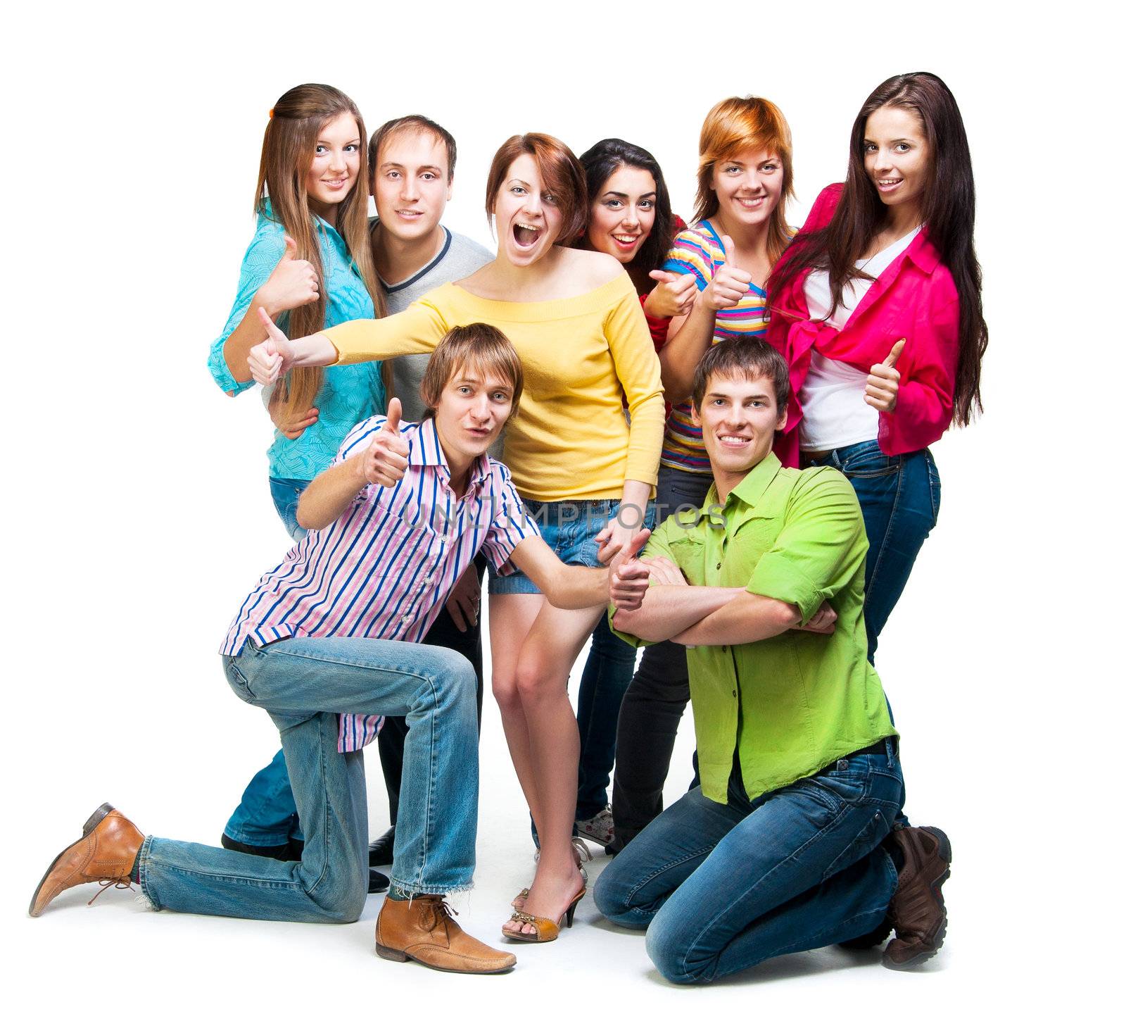 group of casual happy people smiling and standing isolated over a white background