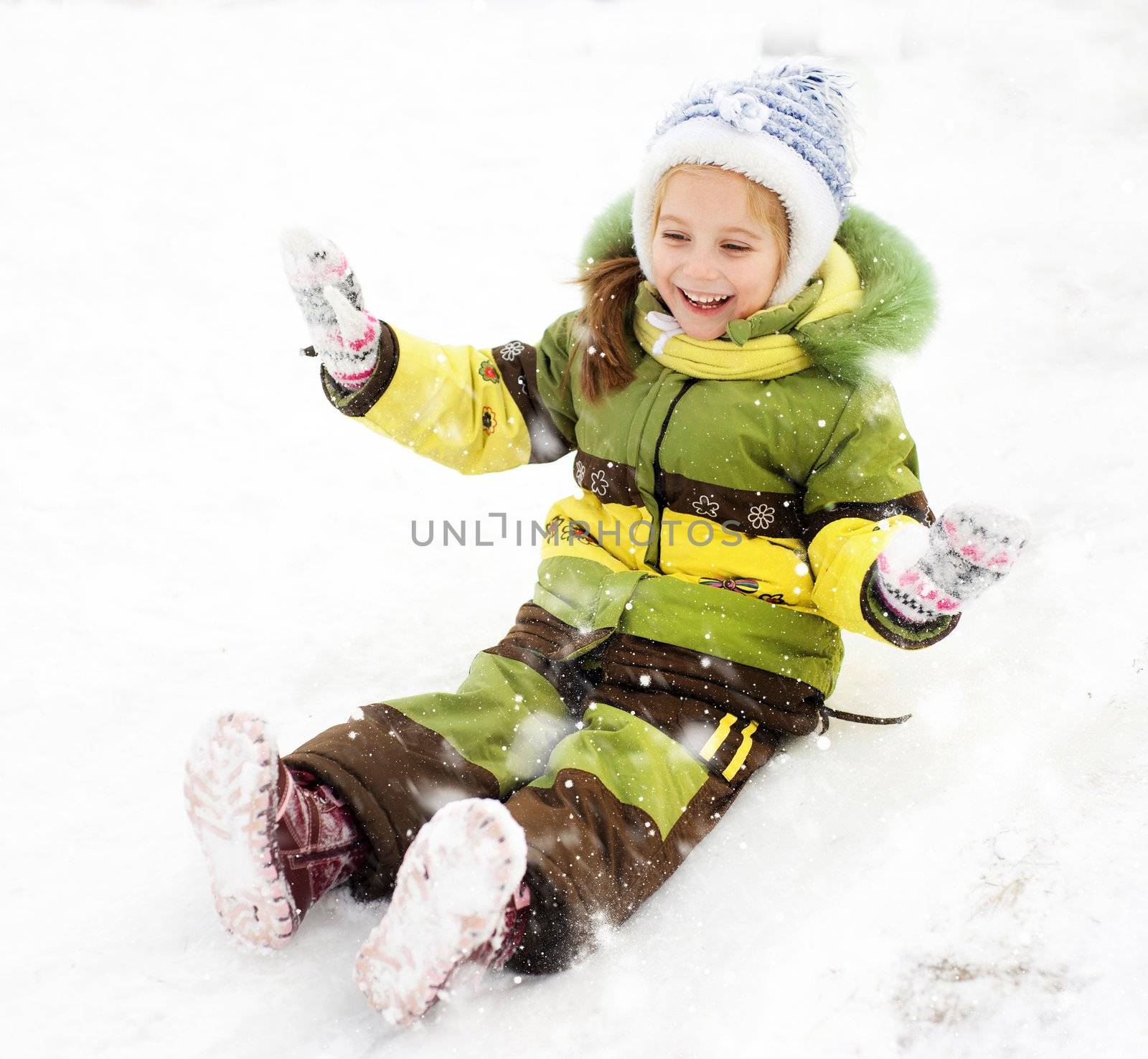 Smiling Little girl on the ice slide