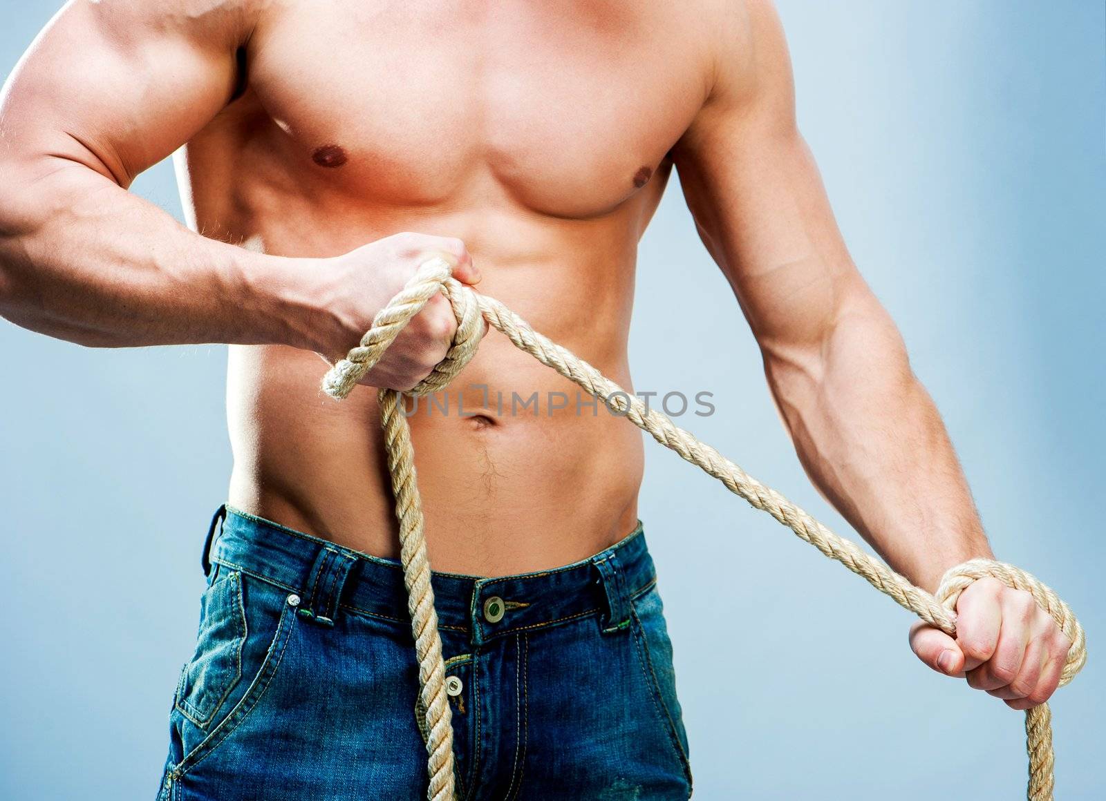 Attractive muscular man torso rope breaks