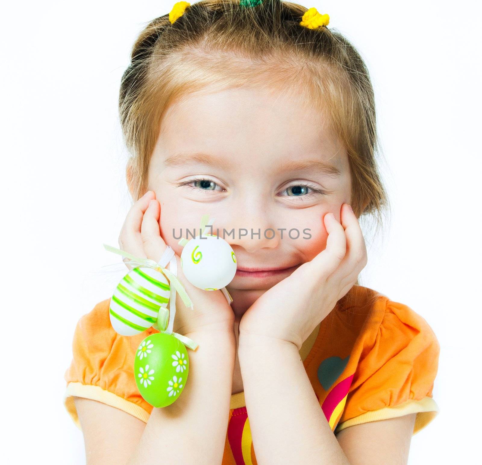Happy little girl with easter eggs. Isolated on white