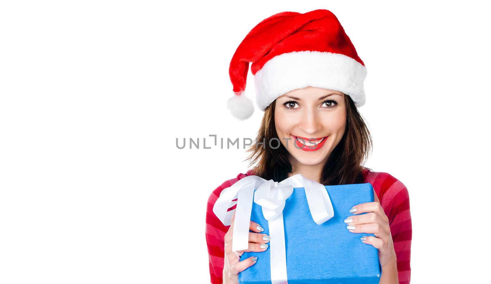 Beautiful girl in Santa hat with blue looking at the camera