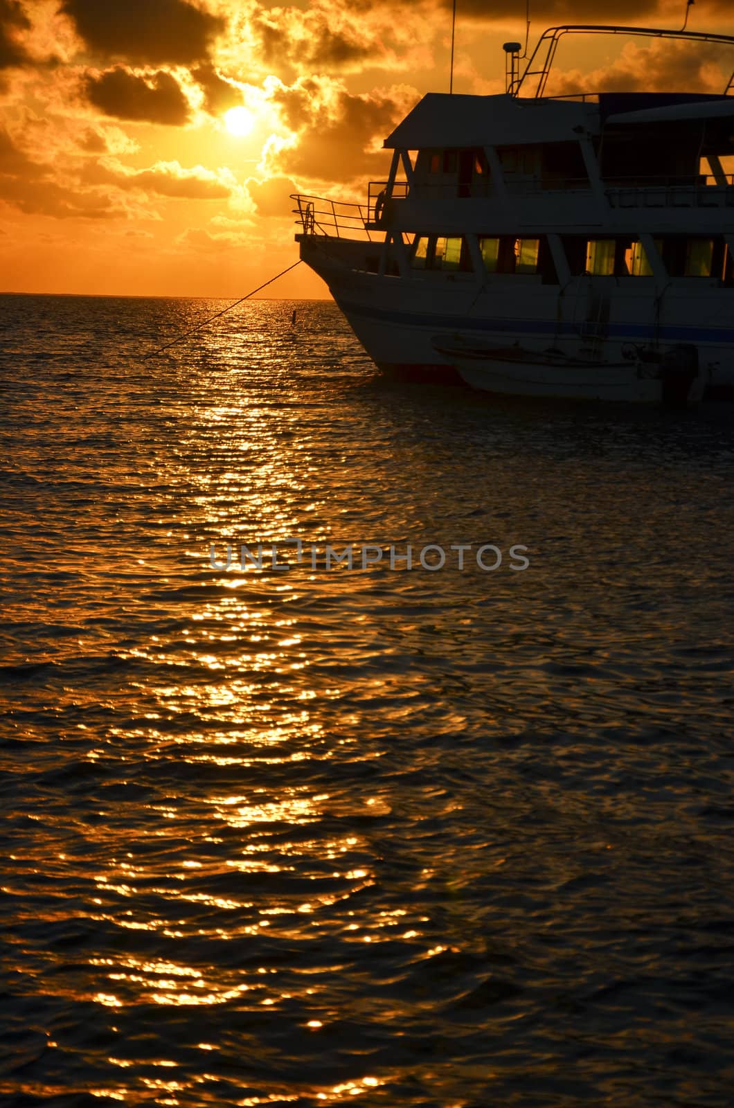 Vertical view of a boat in the Caribbean at sunrise in San Andres, Colombia