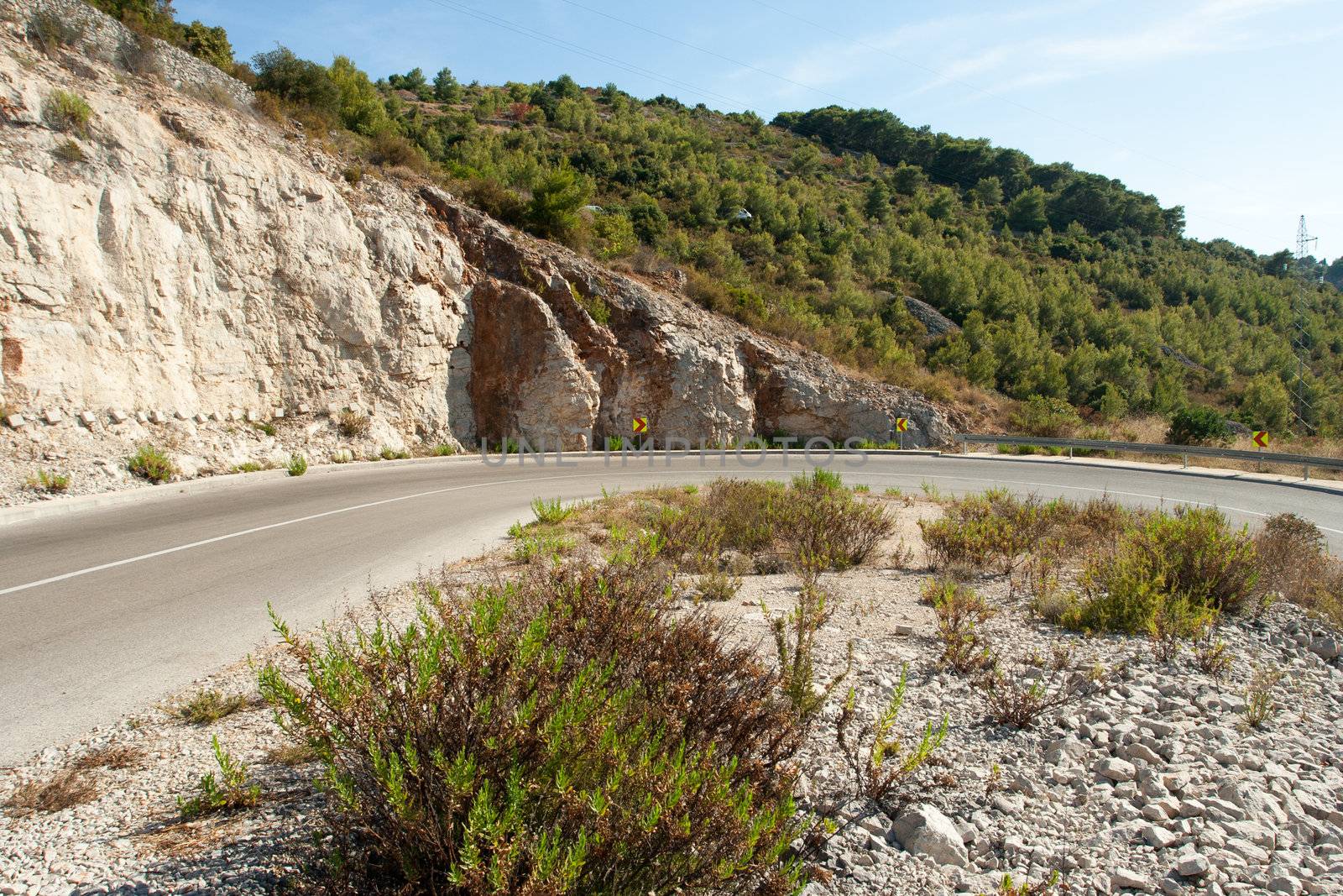 winding road in deserted landscape in vis island