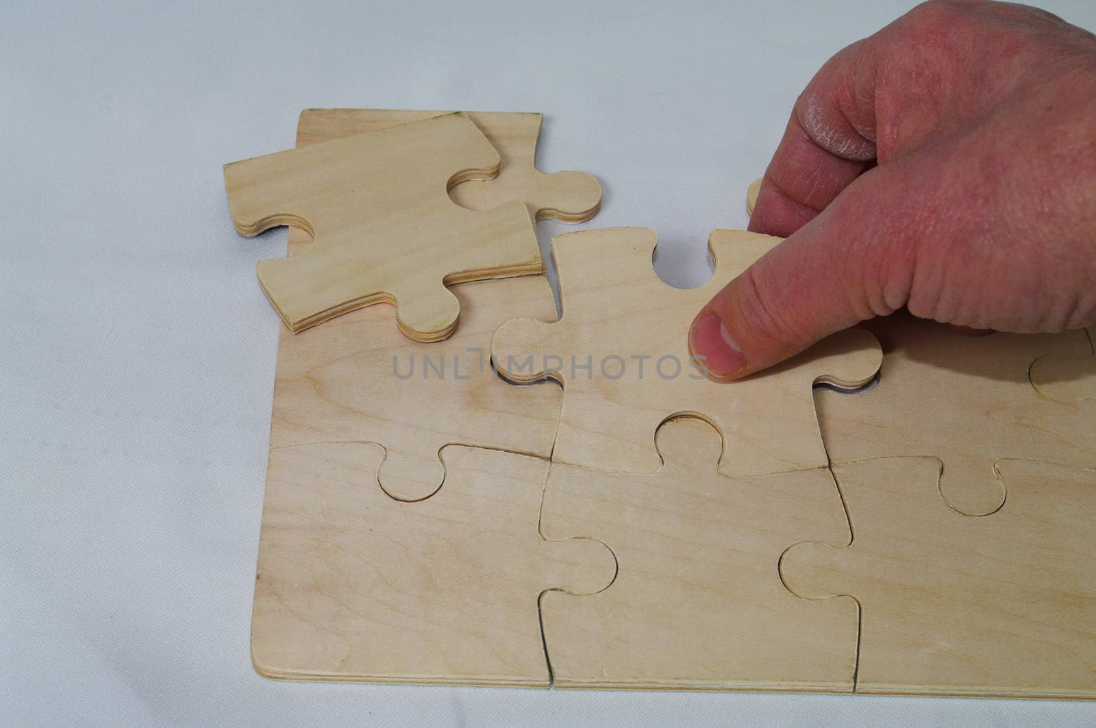 A puzzle being put together