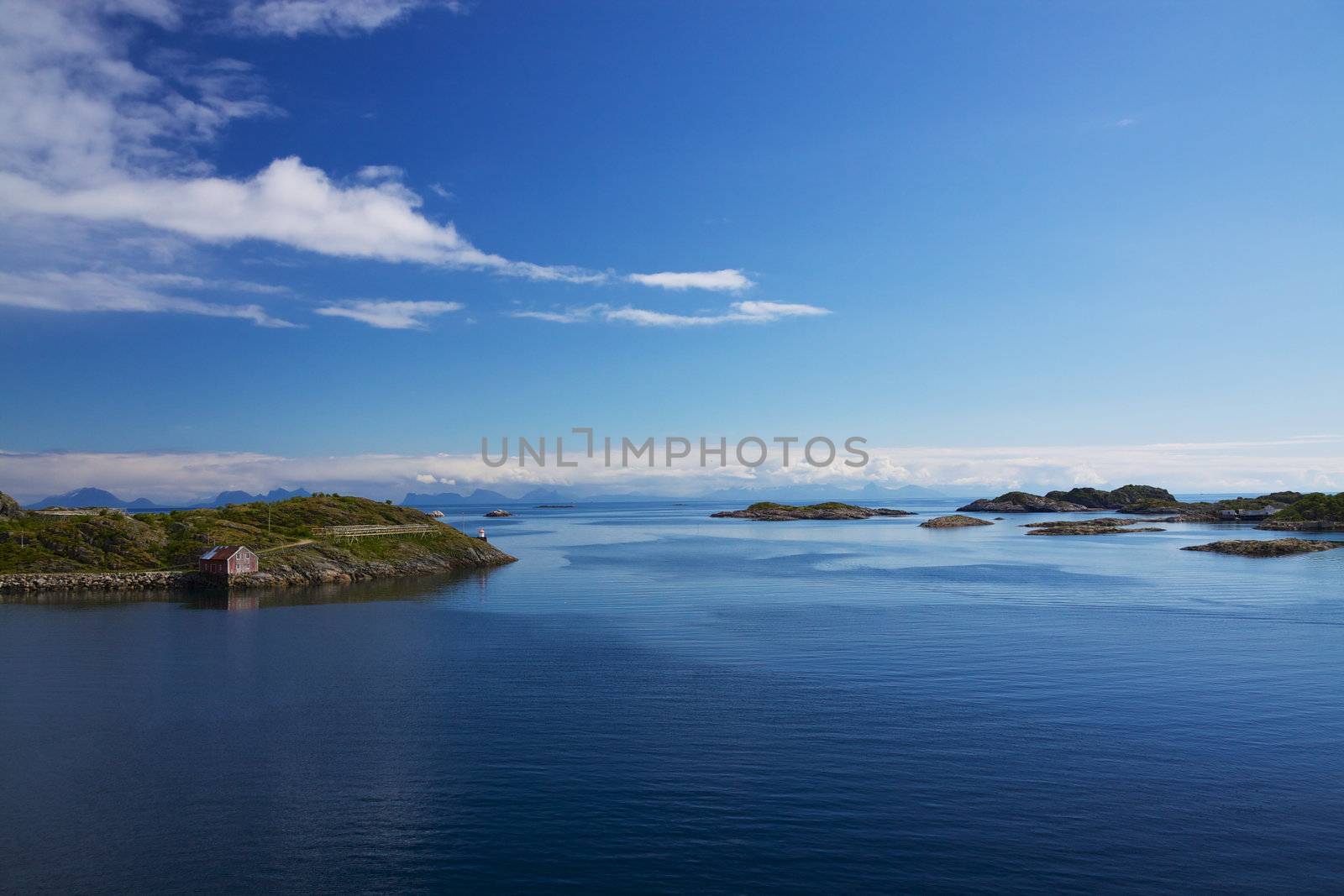 Tiny islands with fishing houses in norwegian sea
