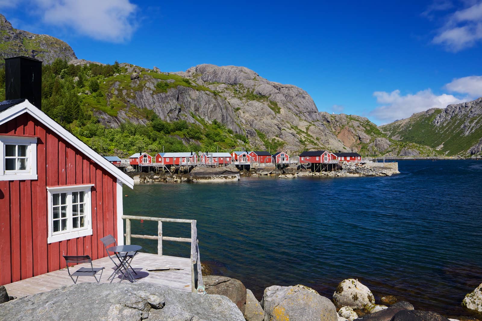 Typical red rorbu fishing huts in village of Nusfjord, unesco heritage on Lofoten islands, Norway