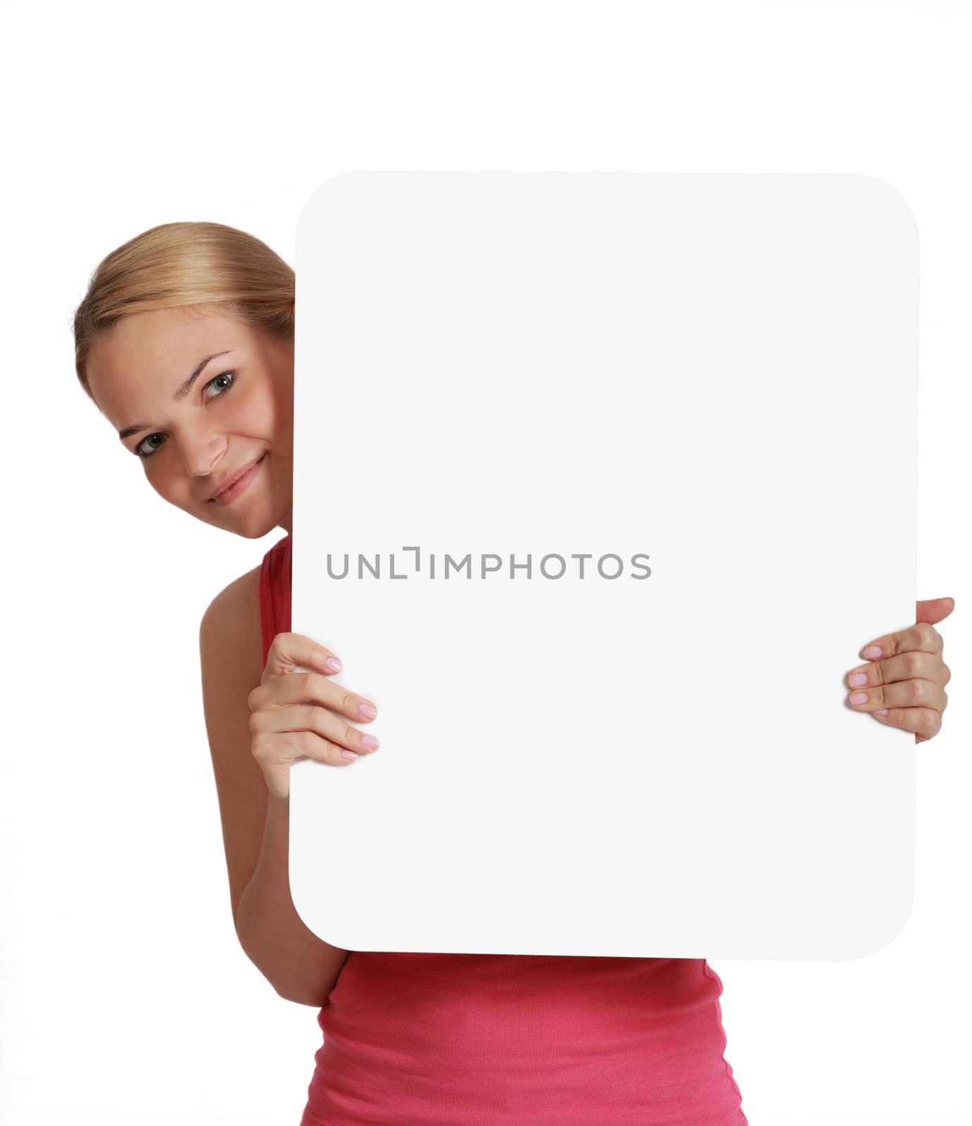 A young woman  holding an empty white bill board against a white background.