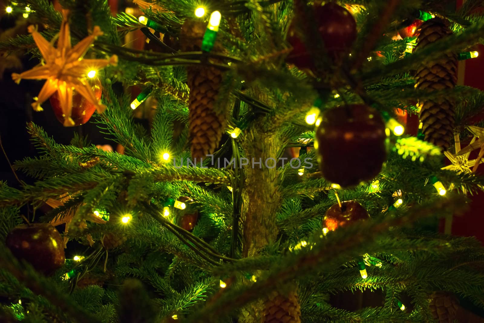 Beautiful traditional christmas decorations on an illuminated xmas tree