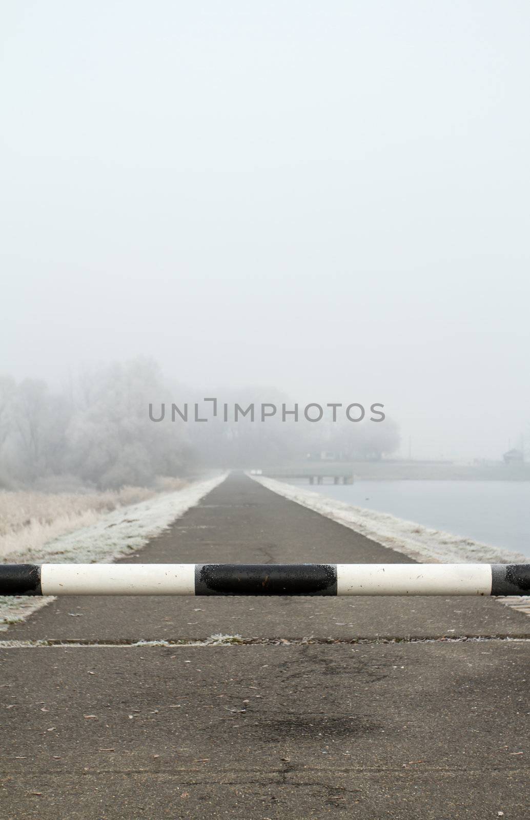 road to far away with barrier on freeze landscape by NagyDodo