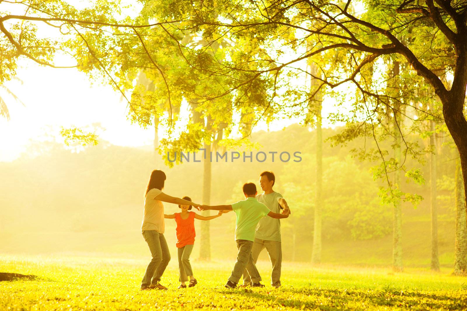 Happy Asian family playing by szefei