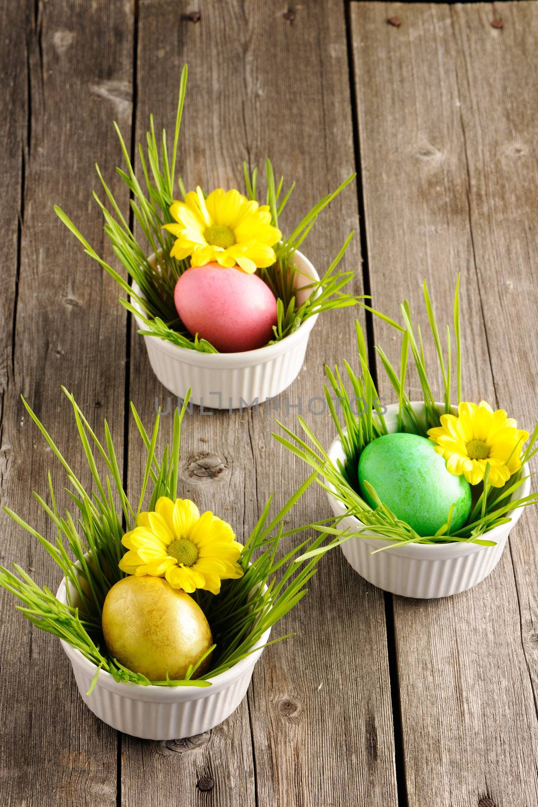 Colored easter eggs on wooden table