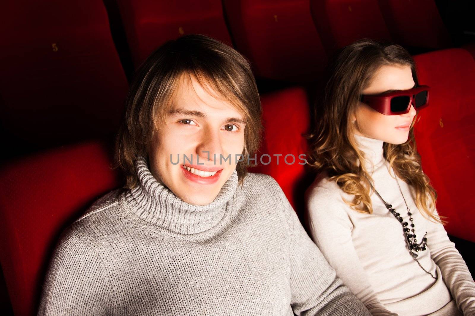 young couple in the cinema to enjoy the movie