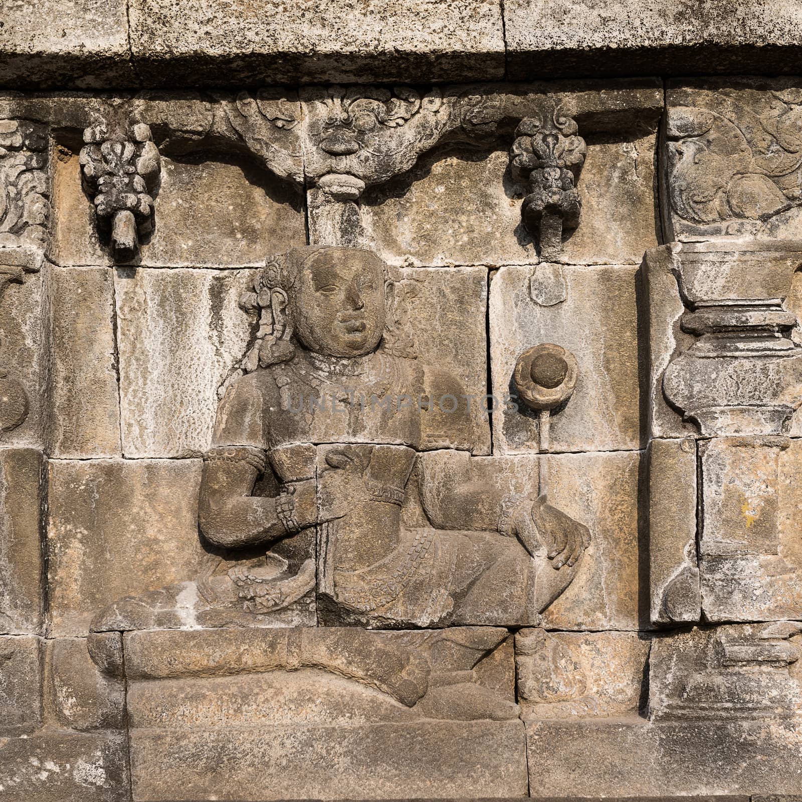 Relief at Borobudur temple on Java, Indonesia by iryna_rasko