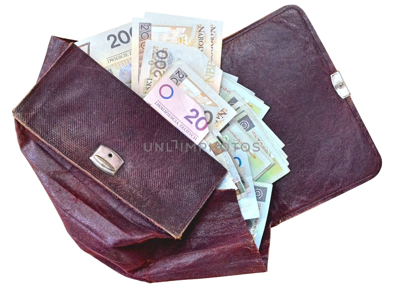 An old leather wallet with a lot of polish money. Isolated on white with path.