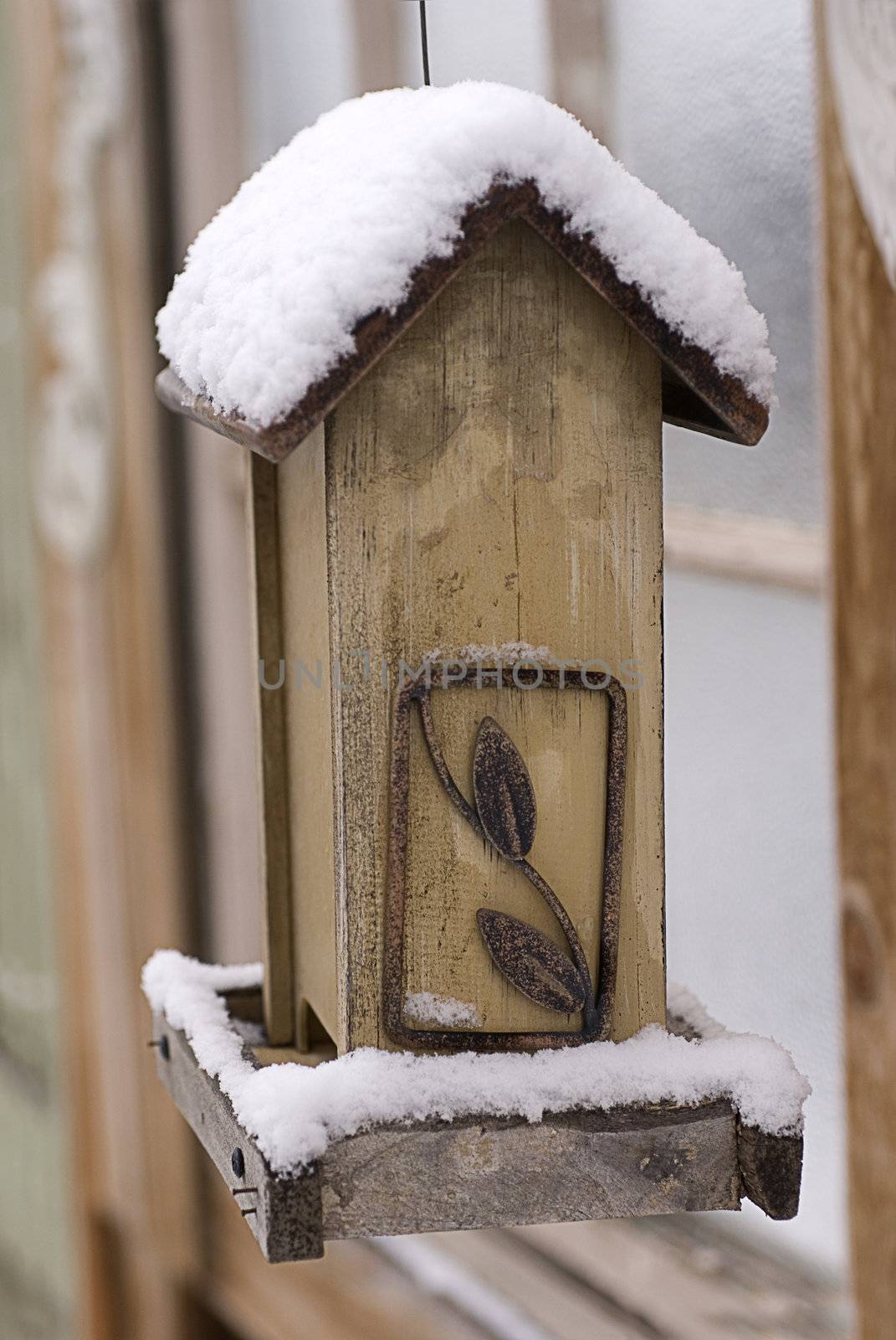 Snow on an Empty Bird Feeder by Eponaleah