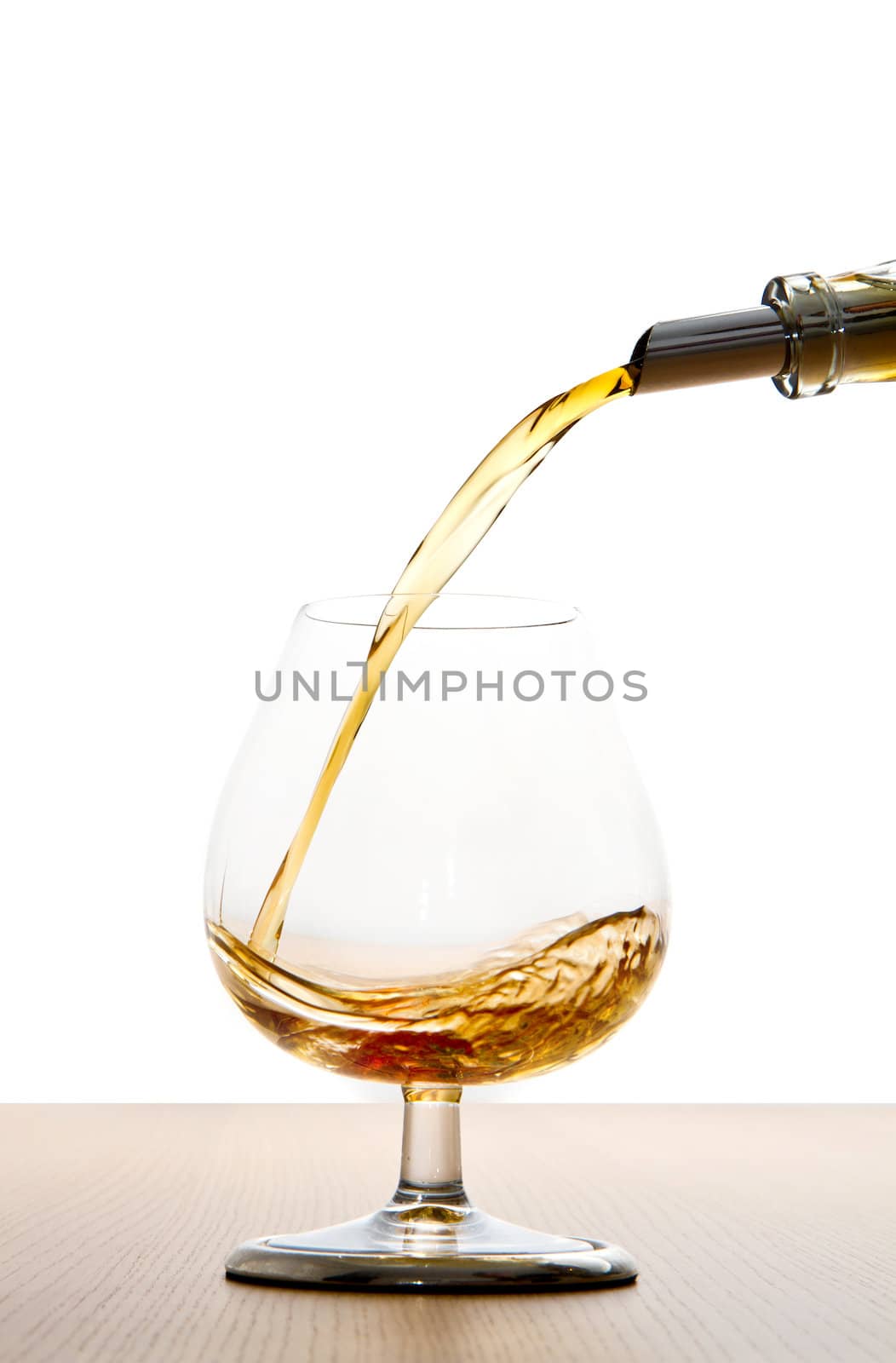 cognac pour into the glass