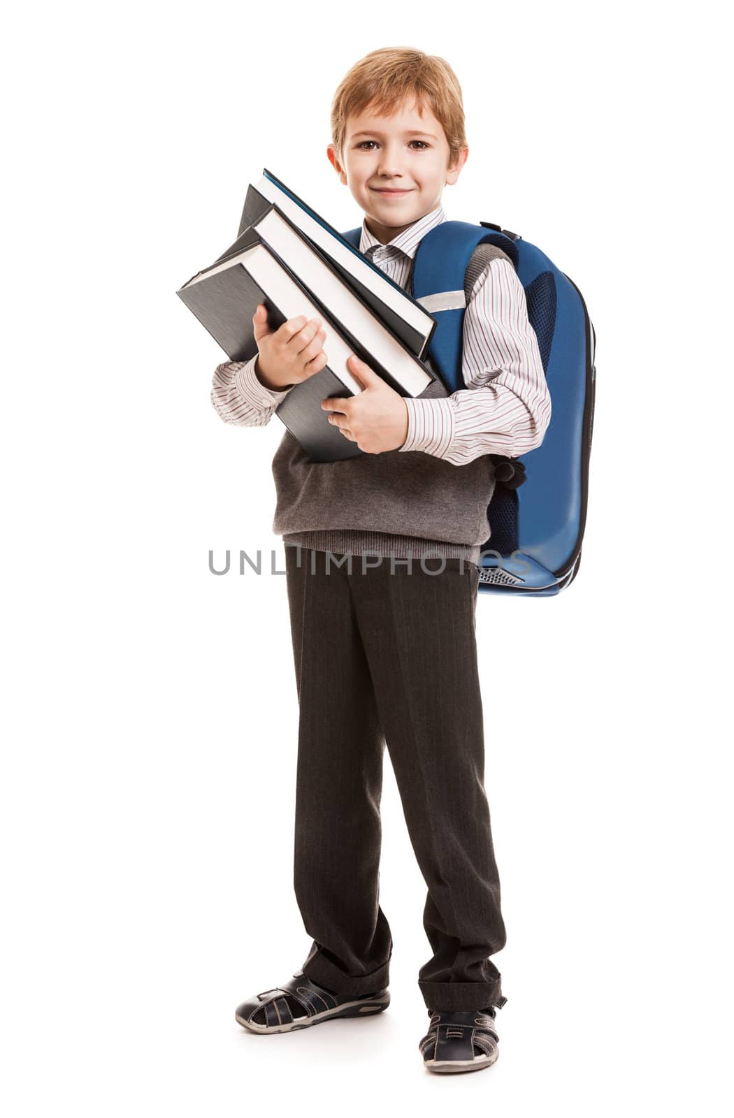 Schoolboy with backpack holding books by ia_64