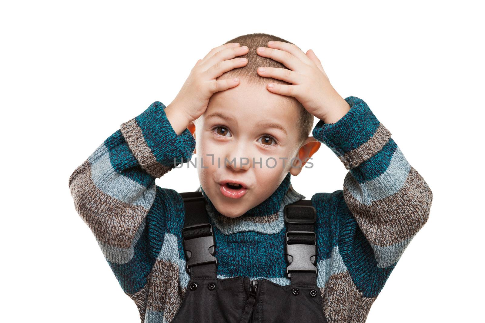 Amazed or surprised child boy hand holding hairs on head