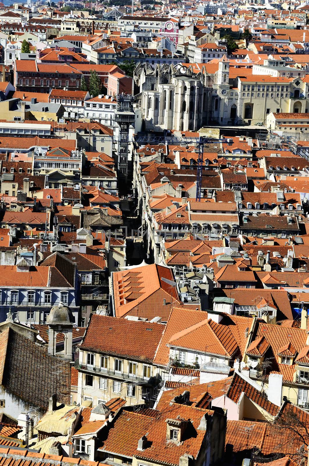 Bird view of central Lisbon with colorful houses and orange roofs