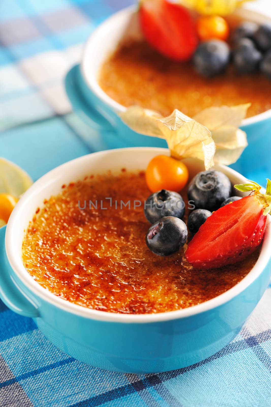 Creme brulee (cream brulee, burnt cream) with fruits and berries