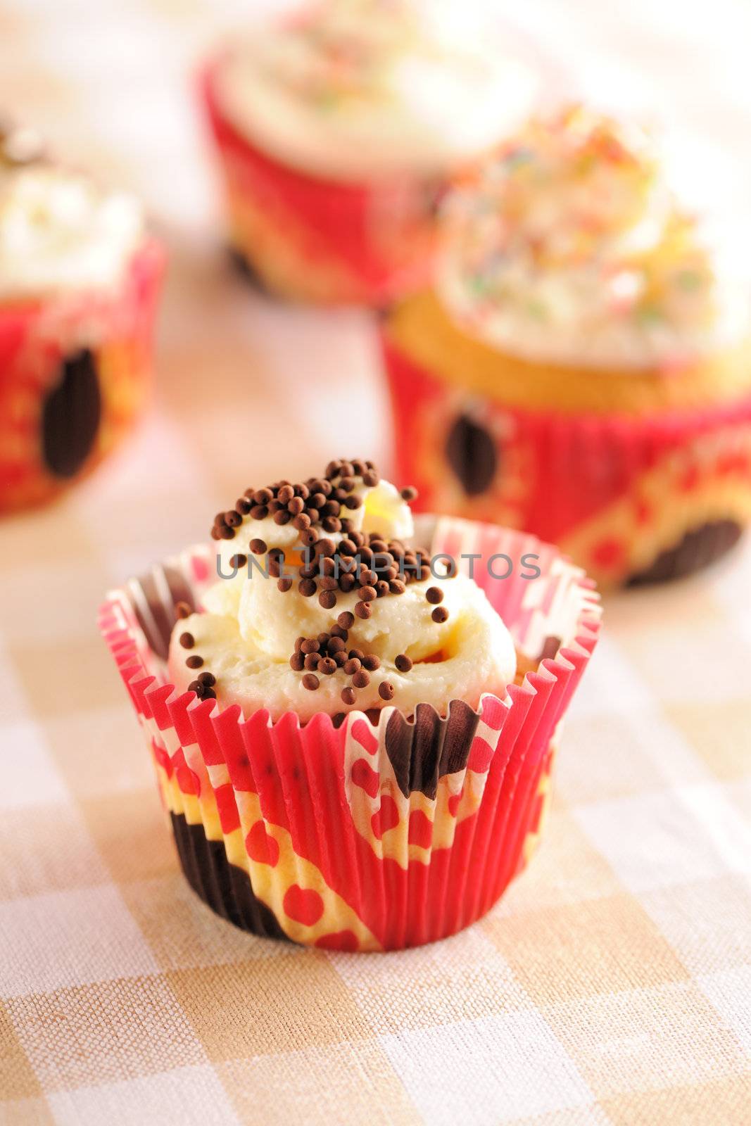 Cupcakes with whipped cream and icing