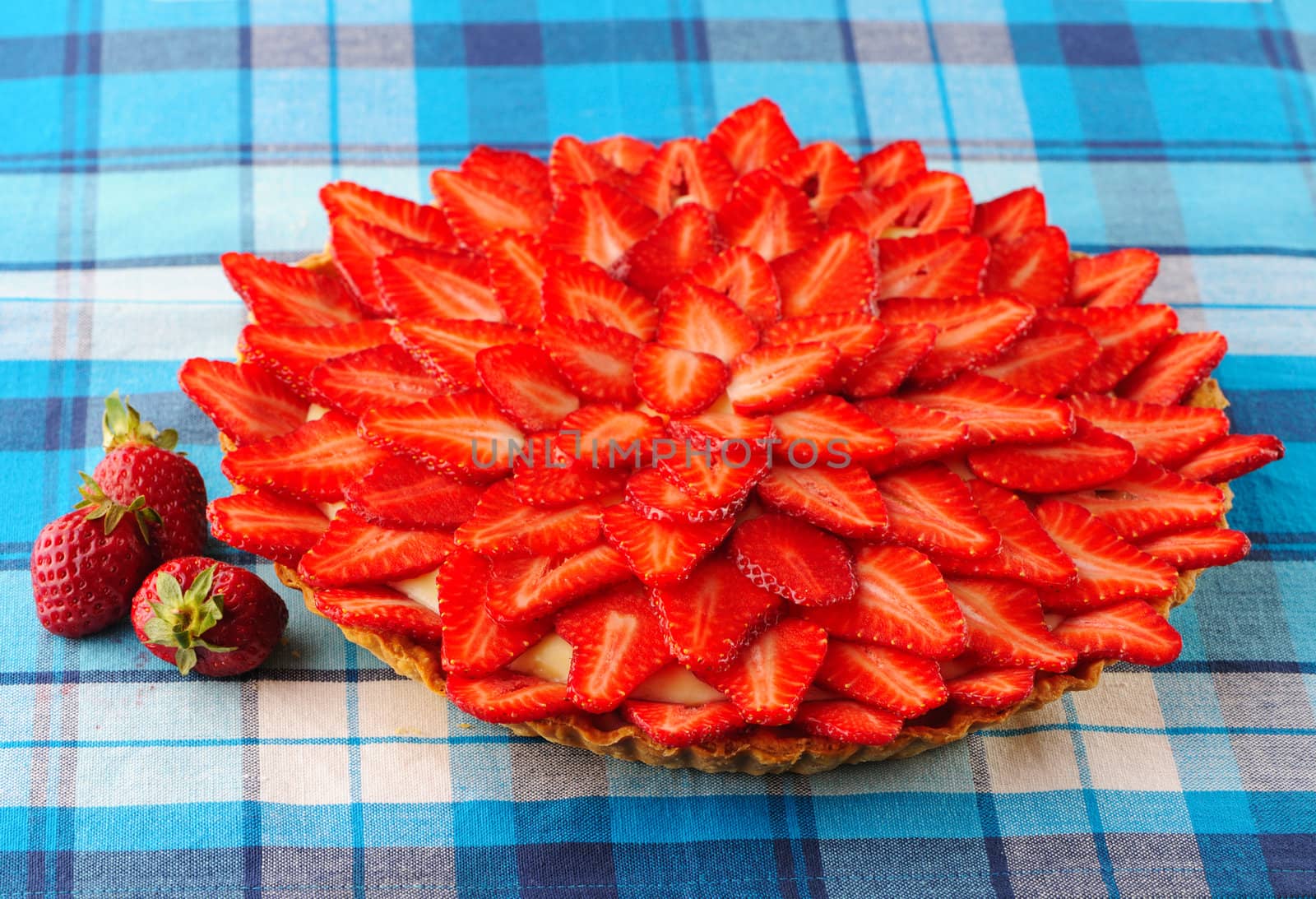Homemade strawberry tart on table