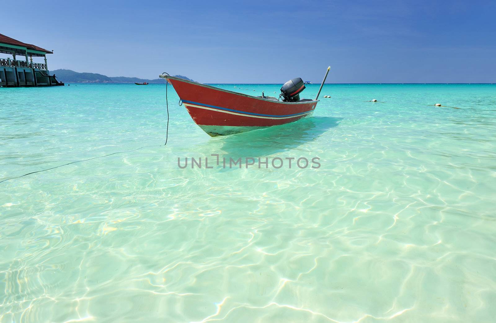 Beautiful beach with motor boat at Perhentian islands, Malaysia