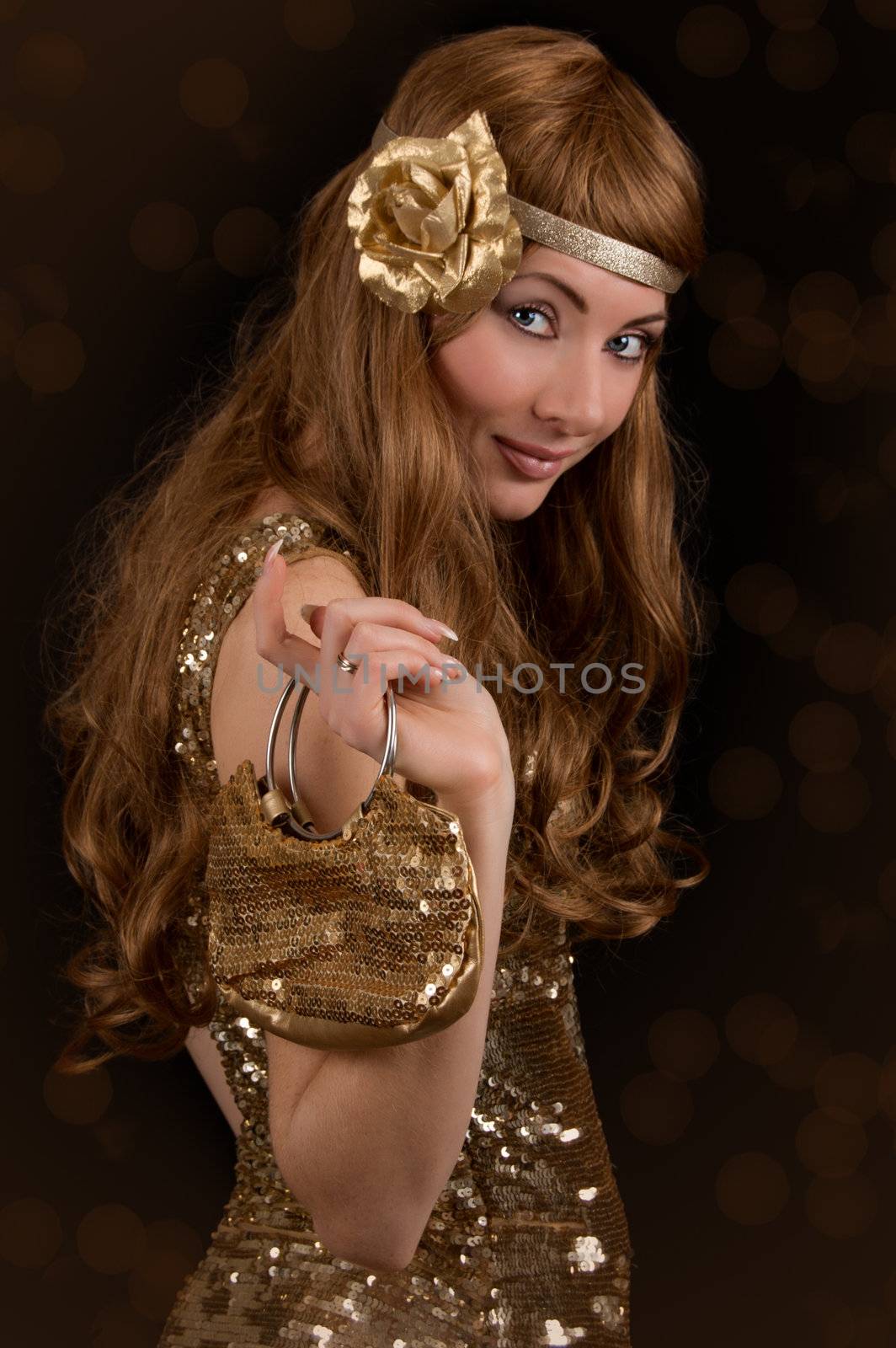 Retro-styled woman in golden dress and bag over black
